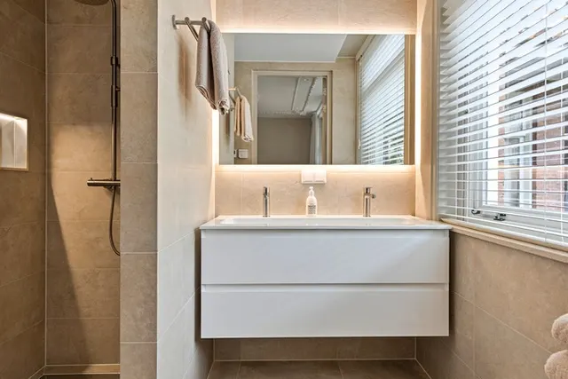 Bathroom vanity and shower at Splendom Vondelpark