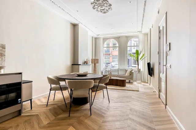 Open-plan kitchen, dining and living area at Splendom Vondelpark